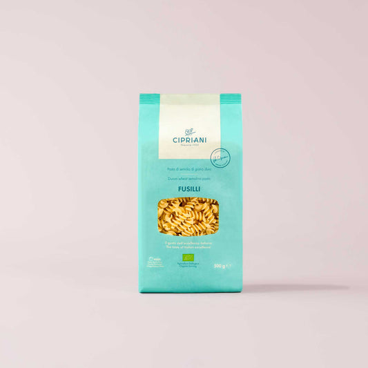 Cipriani Fusilli pasta package on a light pink background